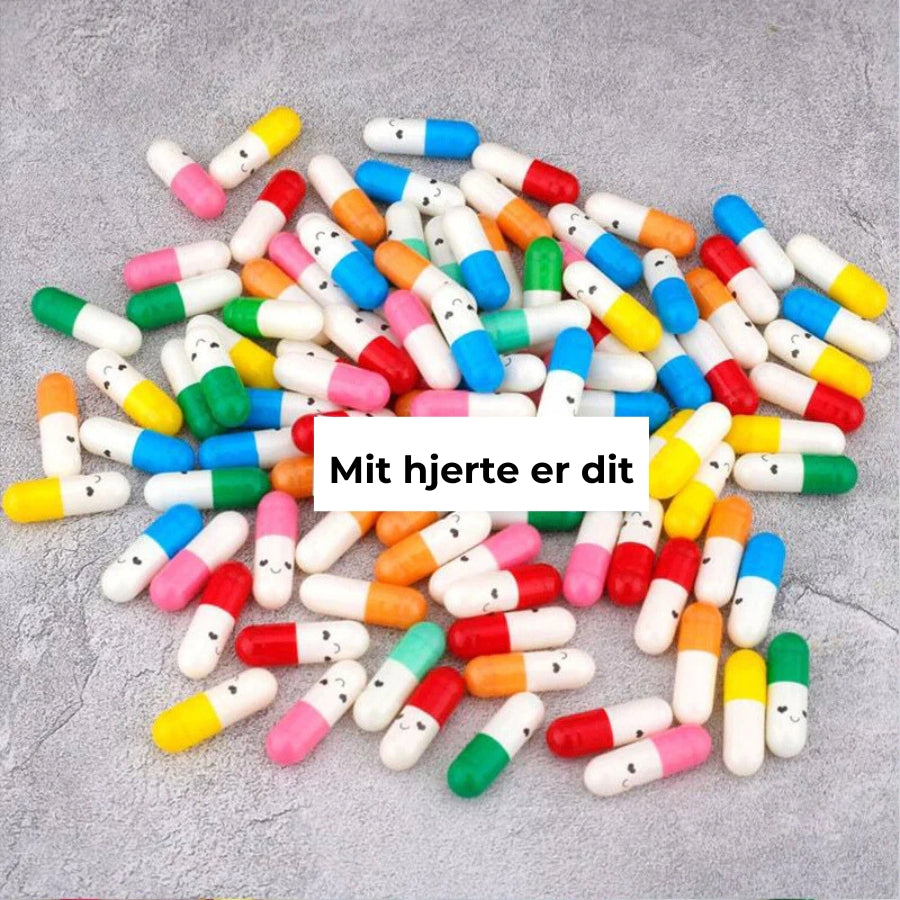 Kapseln mit Nachricht in Geschenkflasche